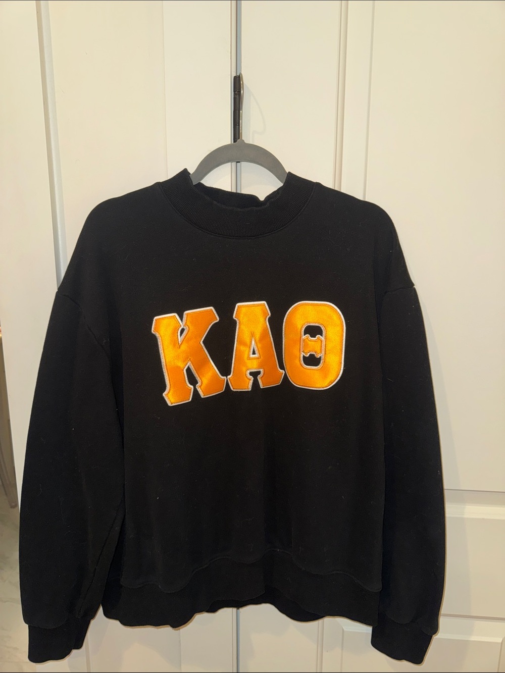 Black Sweatshirt with Bold Yellow-Orange KAO Letters